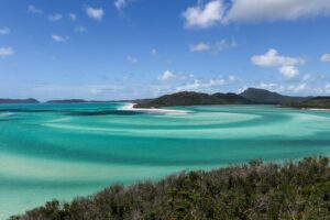 Aerial view of Whitehaven Beach in Australia with swirling white sand and turquoise water in the Whitsundays